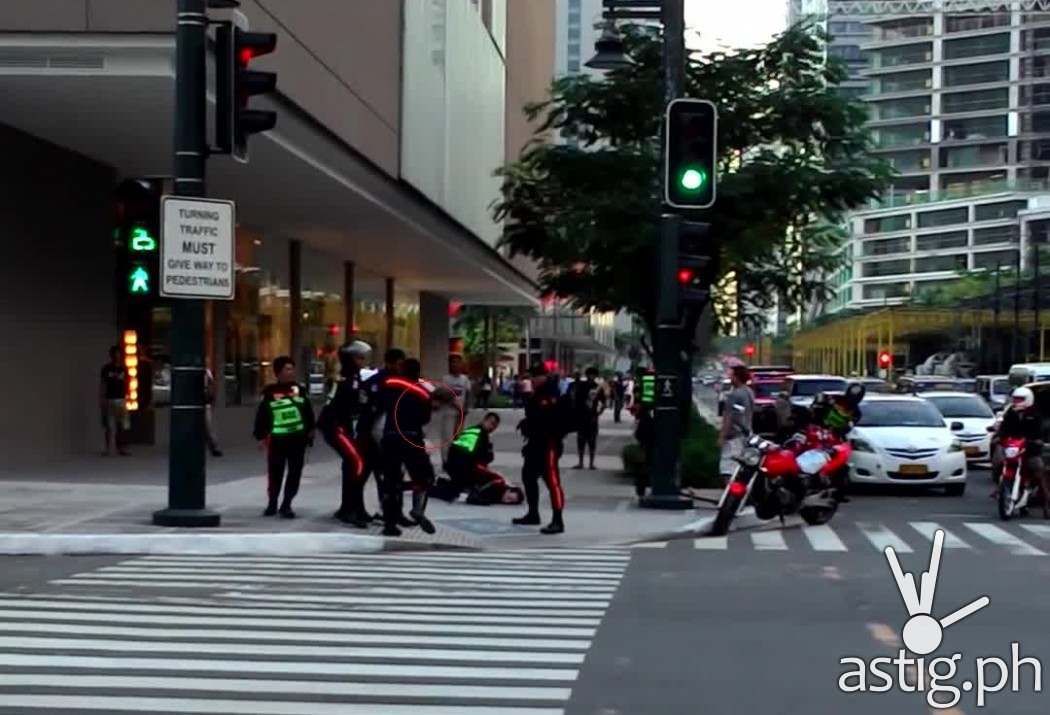 In the video, a BGC guard not wearing a reflective suit can be seen punching the Caucasian man while two others restrain him