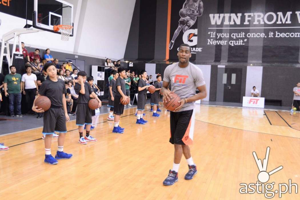Utah Jazz shooting guard Alec Burks showing the participants how its done