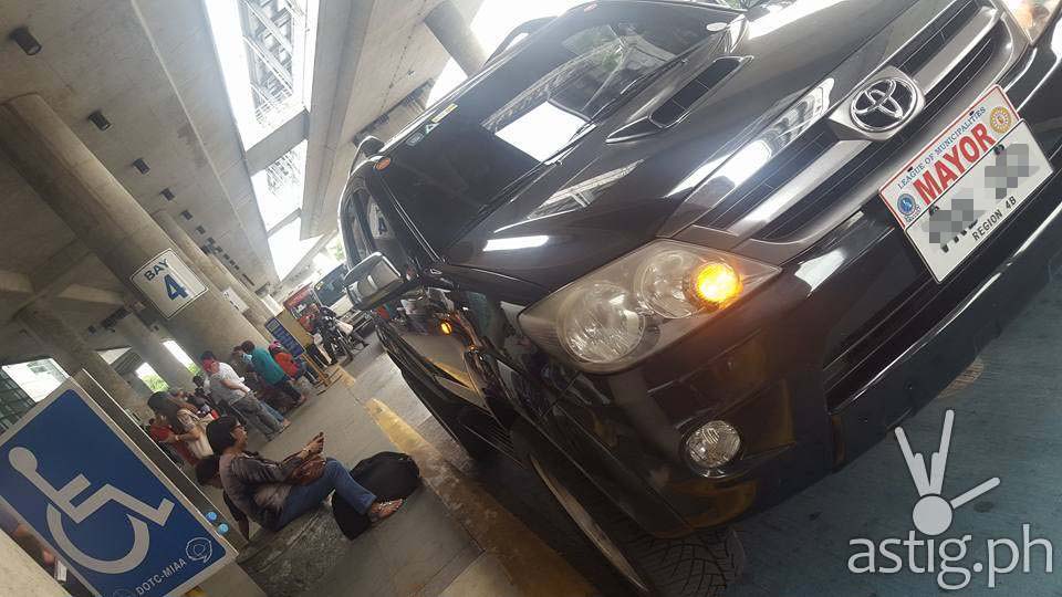 A black Toyota Fortuner with plate# VRB202 and protocol MAYOR plate attached is seen parked at the PWD area of MIAA