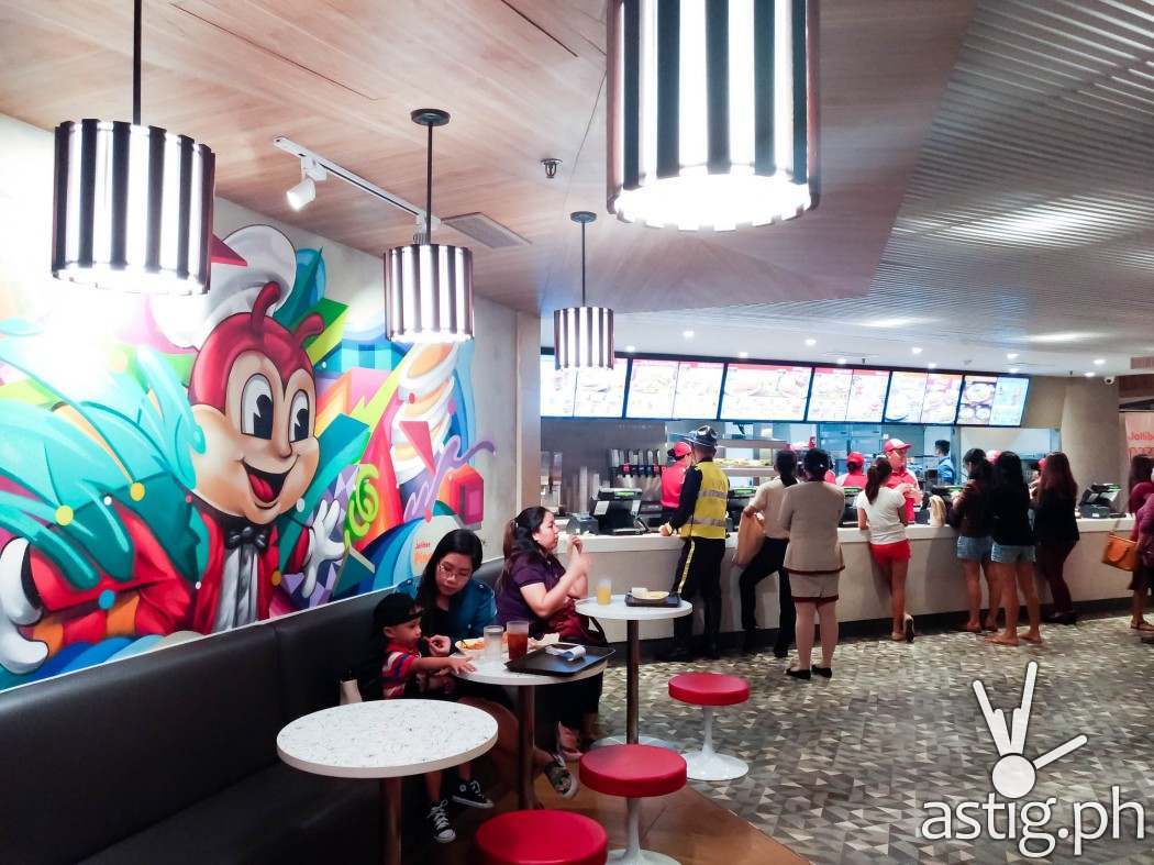 Hand-painted murals decorate the interiors of the redesigned Jollibee Glorietta 4 outlet