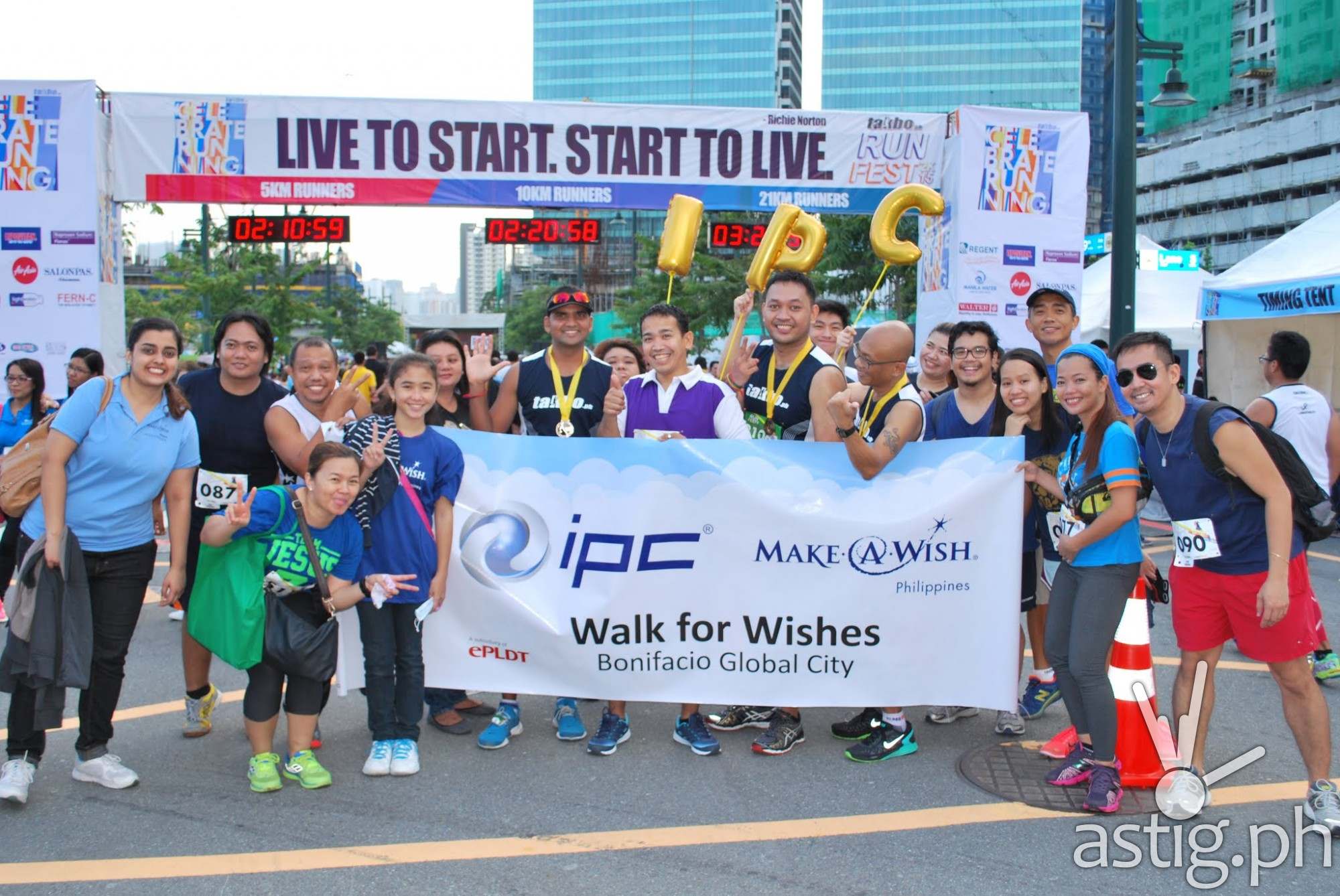 Team IPC with Wish Kid Amie (fifth from left) at the finish line