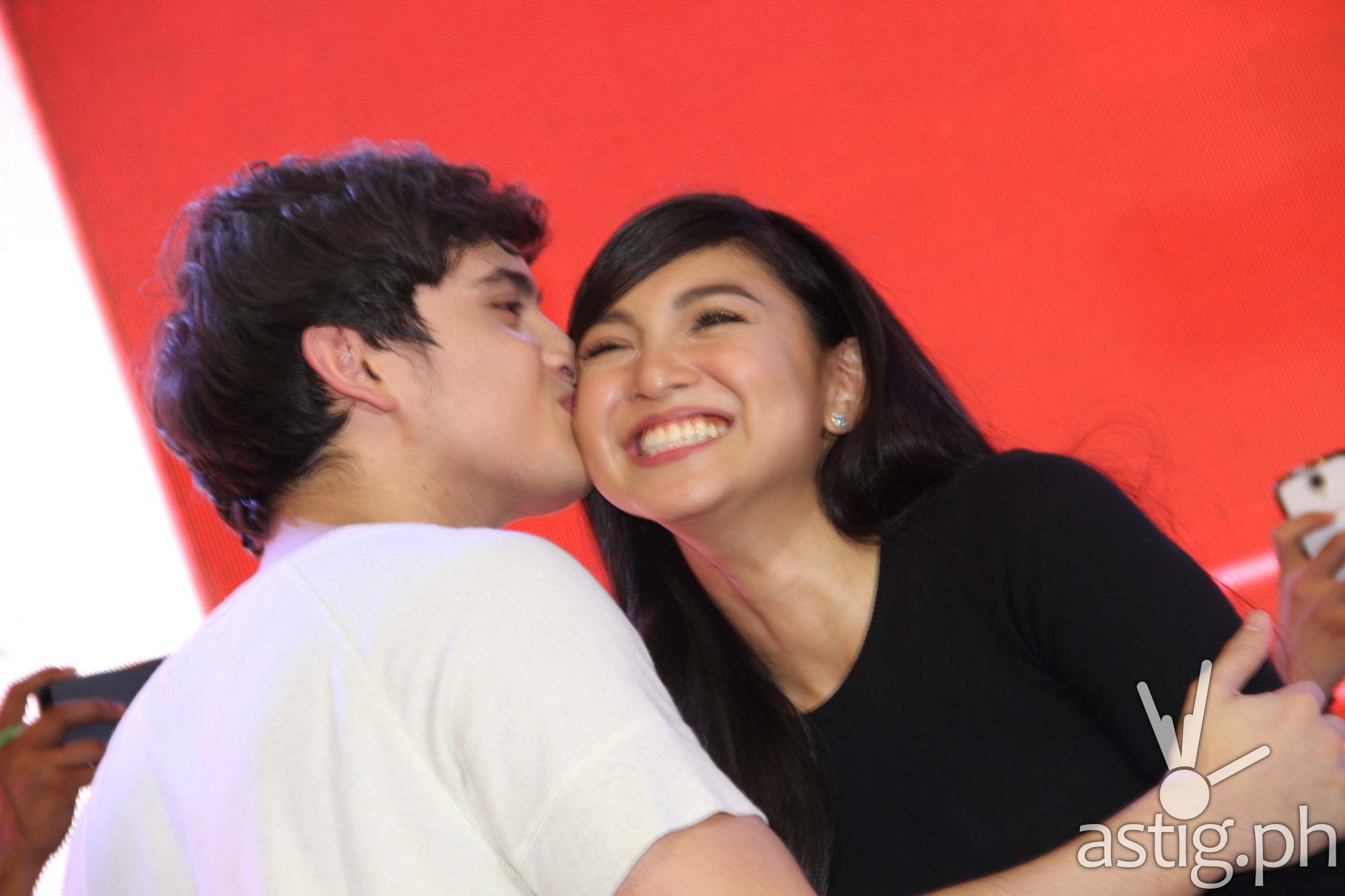 James gives a kiss on the cheek to Nadine due to public demand