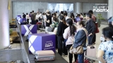 OFWs left speechless after Converge surprised them with gift boxes at Mactan Airport