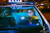 Taxi cab spotted giving cash to passengers