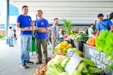 Farming futures  :   Jayson and Juanito proudly showcase a selection of produce at the SM City Clark’s Weekend Market.